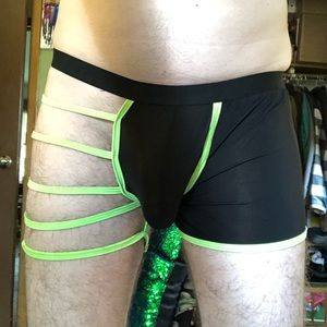 Black mesh/semi-sheer and neon green string trunks